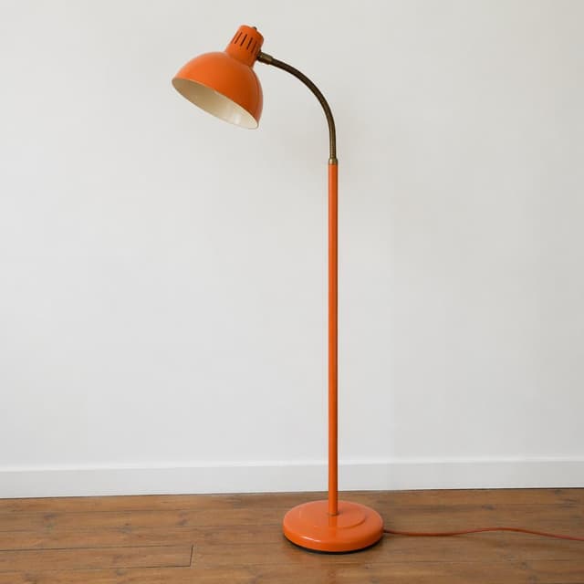 A vintage orange floor lamp with a curved neck, standing alone against a plain white wall
Chat attachment instruction: Generate exactly one in-world chat attachment, not a collage, split-screen, comic panel, flashback, or explanatory scene. If the prompt is a screenshot, phone screen, document, note, card, map, receipt, label, object photo, or photo someone took, frame that artifact directly. A name appearing in visible text or in 'photo taken by X' is not an instruction to draw that person. Do not show recurring story participants as visible people unless the prompt itself explicitly says they are visible. Keep unrequested people, faces, and bodies out of the image.