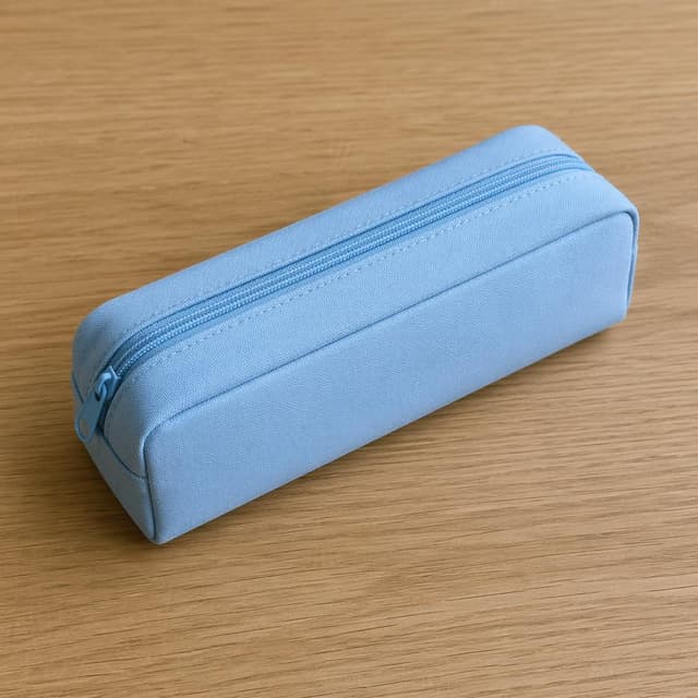 a pale-blue pencil case resting on a plain wooden desk surface
Chat attachment instruction: Generate exactly one in-world chat attachment, not a collage, split-screen, comic panel, flashback, or explanatory scene. If the prompt is a screenshot, phone screen, document, note, card, map, receipt, label, object photo, or photo someone took, frame that artifact directly. A name appearing in visible text or in 'photo taken by X' is not an instruction to draw that person. Do not show recurring story participants as visible people unless the prompt itself explicitly says they are visible. Keep unrequested people, faces, and bodies out of the image. Do not add readable text unless the prompt explicitly asks for visible text.