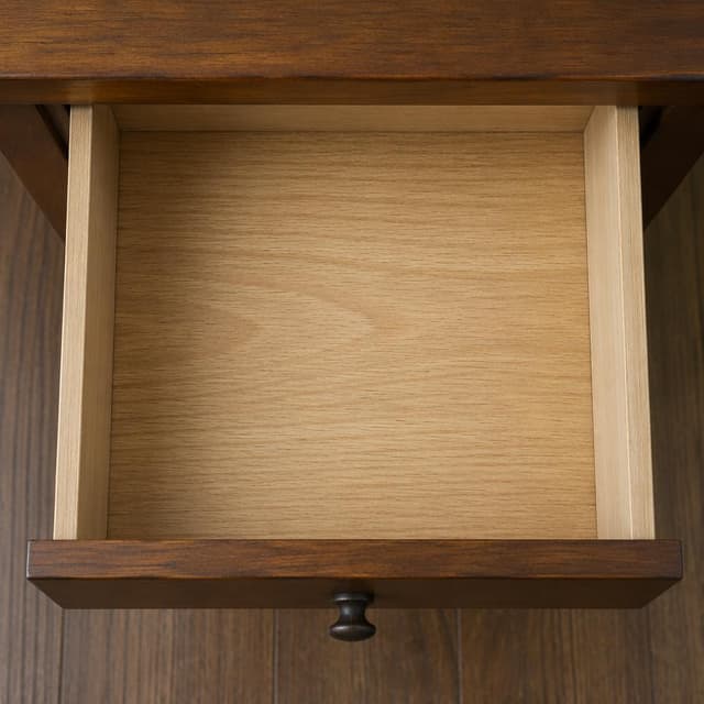 a small open wooden drawer, completely empty, viewed from directly above
Chat attachment instruction: Generate exactly one in-world chat attachment, not a collage, split-screen, comic panel, flashback, or explanatory scene. If the prompt is a screenshot, phone screen, document, note, card, map, receipt, label, object photo, or photo someone took, frame that artifact directly. A name appearing in visible text or in 'photo taken by X' is not an instruction to draw that person. Do not show recurring story participants as visible people unless the prompt itself explicitly says they are visible. Keep unrequested people, faces, and bodies out of the image.