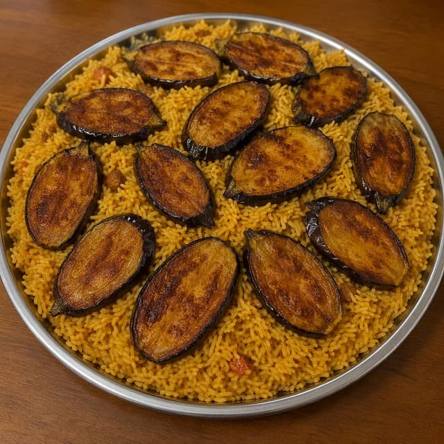 A round platter of golden rice with fried eggplant slices arranged on top, on a plain table
Chat attachment instruction: Generate exactly one in-world chat attachment, not a collage, split-screen, comic panel, flashback, or explanatory scene. If the prompt is a screenshot, phone screen, document, note, card, map, receipt, label, object photo, or photo someone took, frame that artifact directly. A name appearing in visible text or in 'photo taken by X' is not an instruction to draw that person. Do not show recurring story participants as visible people unless the prompt itself explicitly says they are visible. Keep unrequested people, faces, and bodies out of the image.