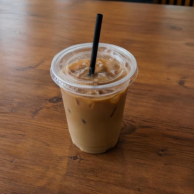 A cold cup of coffee on a plain wooden table
Chat attachment instruction: Generate exactly one in-world chat attachment, not a collage, split-screen, comic panel, flashback, or explanatory scene. If the prompt is a screenshot, phone screen, document, note, card, map, receipt, label, object photo, or photo someone took, frame that artifact directly. A name appearing in visible text or in 'photo taken by X' is not an instruction to draw that person. Do not show recurring story participants as visible people unless the prompt itself explicitly says they are visible. Keep unrequested people, faces, and bodies out of the image.