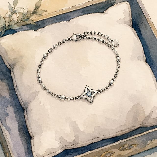 A small silver bracelet resting on a soft fabric cushion, charming ink and watercolor painting, clean lines, storybook style
Chat attachment instruction: Generate exactly one in-world chat attachment, not a collage, split-screen, comic panel, flashback, or explanatory scene. If the prompt is a screenshot, phone screen, document, note, card, map, receipt, label, object photo, or photo someone took, frame that artifact directly. A name appearing in visible text or in 'photo taken by X' is not an instruction to draw that person. Do not show recurring story participants as visible people unless the prompt itself explicitly says they are visible. Keep unrequested people, faces, and bodies out of the image.