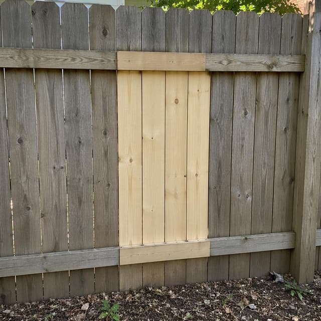 A section of wooden fence with a new light-colored wood patch
Chat attachment instruction: Generate exactly one in-world chat attachment, not a collage, split-screen, comic panel, flashback, or explanatory scene. If the prompt is a screenshot, phone screen, document, note, card, map, receipt, label, object photo, or photo someone took, frame that artifact directly. A name appearing in visible text or in 'photo taken by X' is not an instruction to draw that person. Do not show recurring story participants as visible people unless the prompt itself explicitly says they are visible. Keep unrequested people, faces, and bodies out of the image.