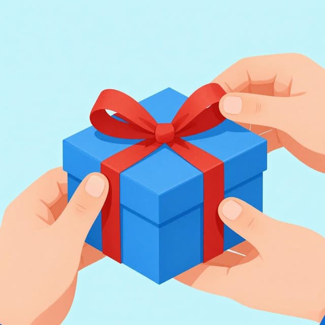 A small gift box being carefully wrapped in blue paper with a red ribbon.