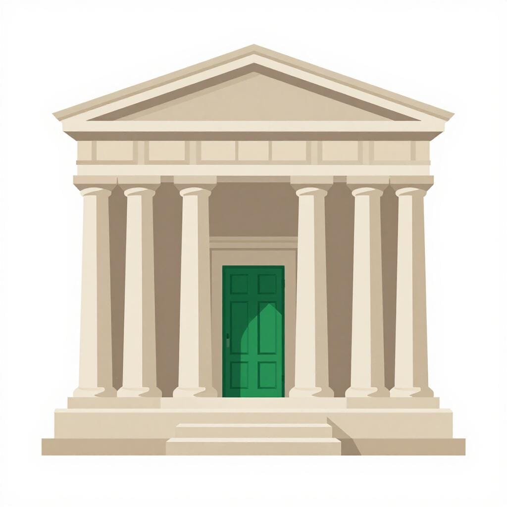 A classic stone bank building with tall pillars and a large heavy door.