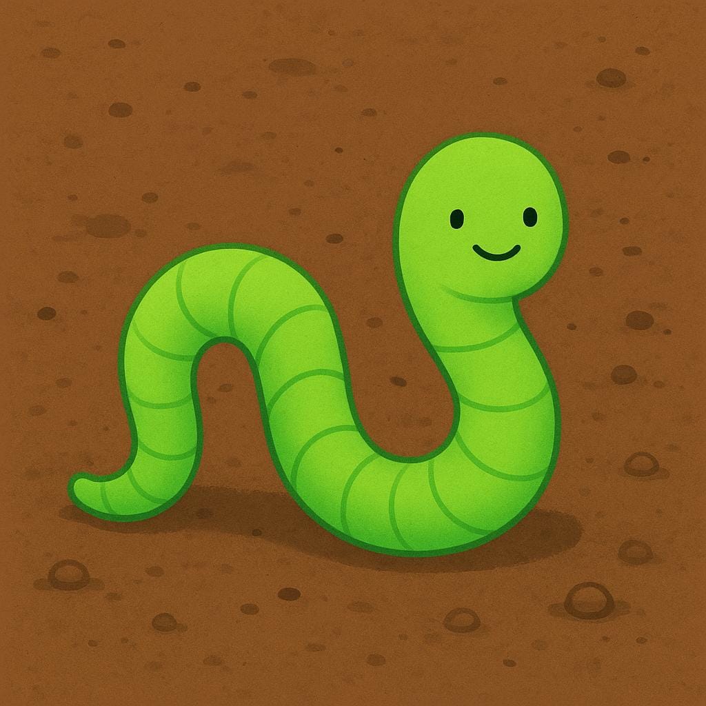 A bright green earthworm curled slightly on a patch of rich brown soil.