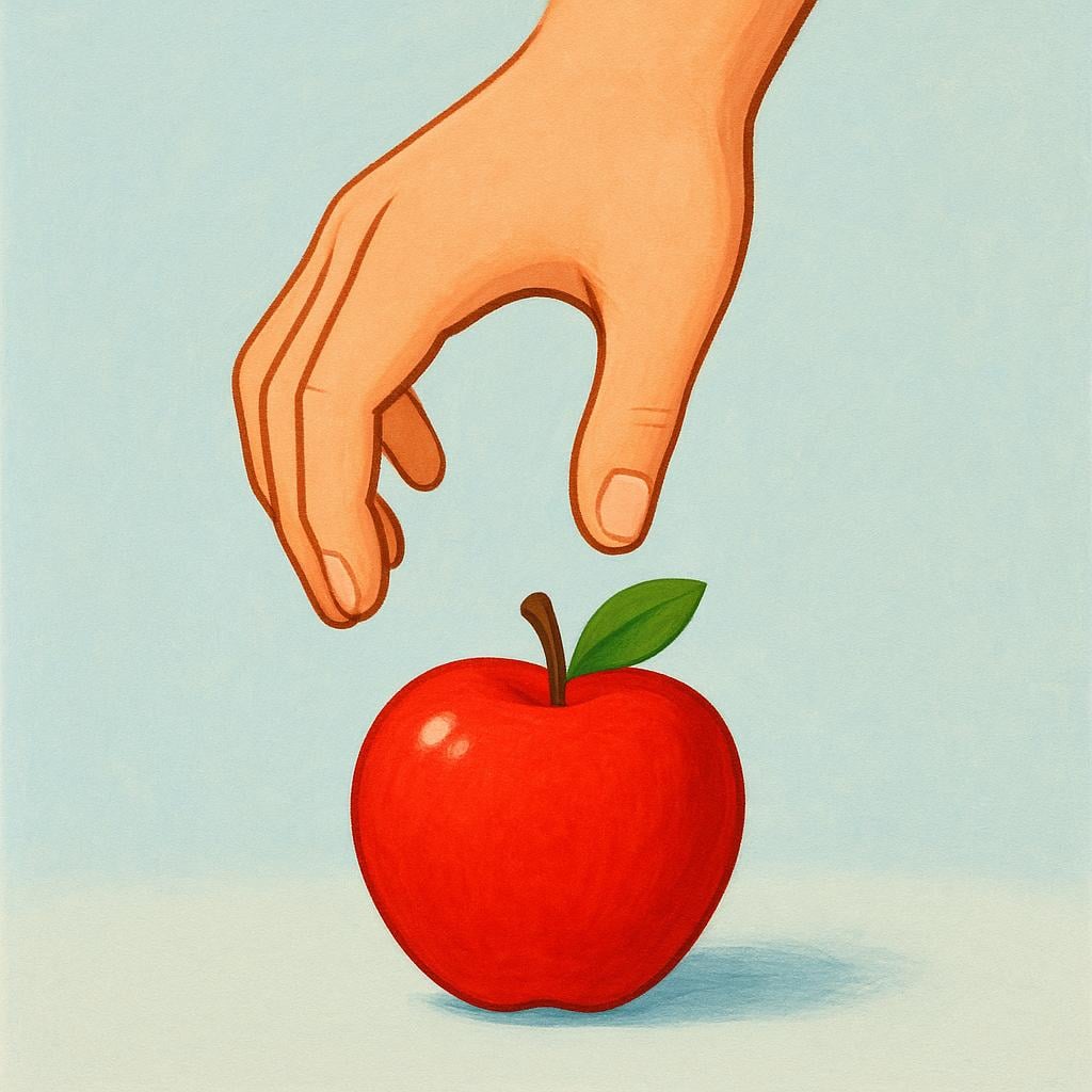 A cartoon hand gently picking up a colorful red apple from a flat surface.