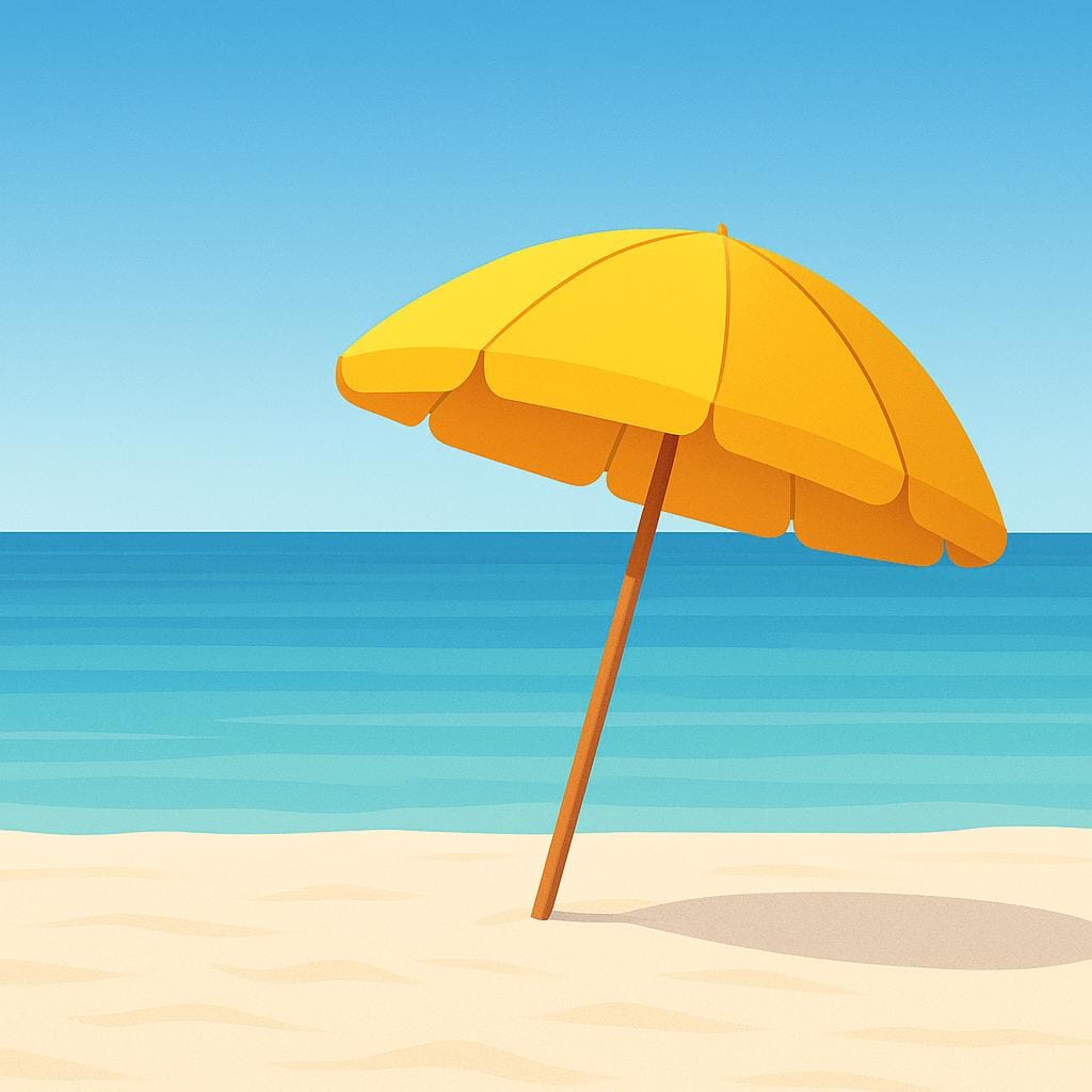 A bright yellow beach umbrella stuck in white sand, with the gentle blue ocean visible in the background under a sunny sky.