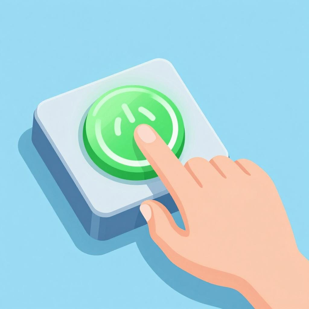 A hand pressing a large glowing green power button on a simple electronic device.