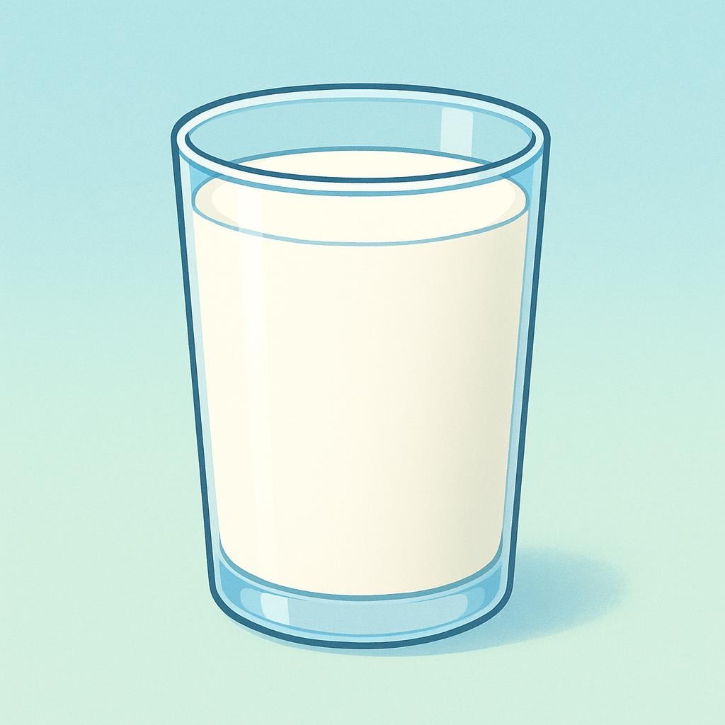 A tall, clear drinking glass filled completely with rich, creamy white milk, suggesting whole milk.