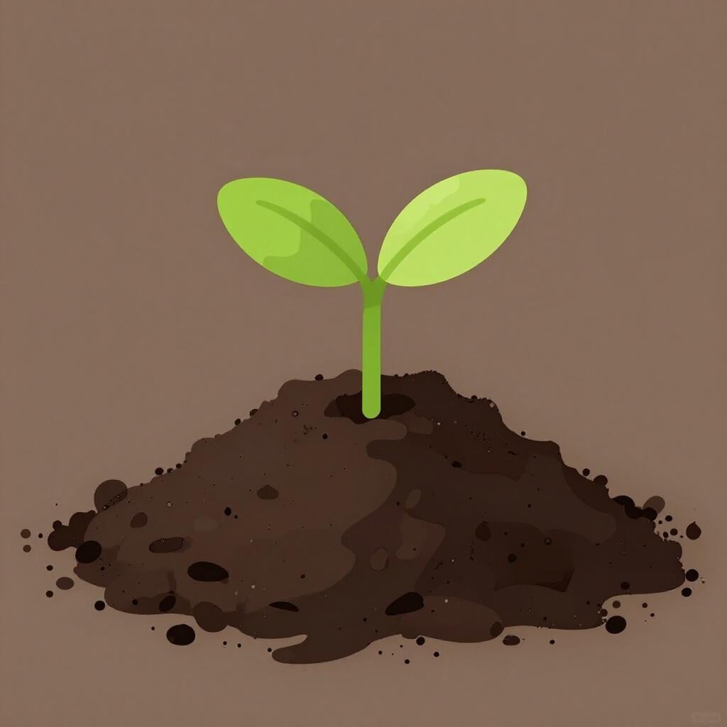 A small pile of dark brown soil with green leaves sprouting from it.