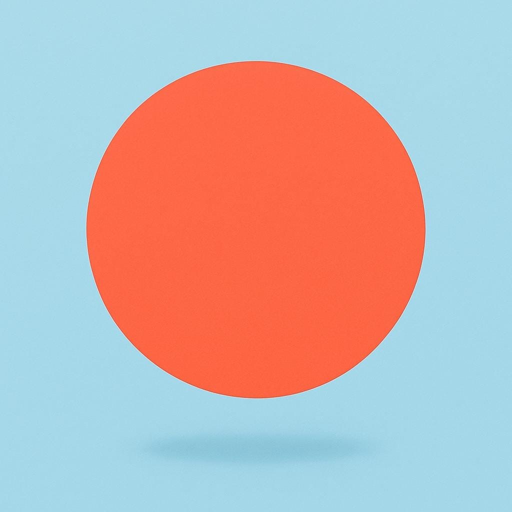 A single, perfectly circular, flat, brightly colored geometric disc floating in a simple background.