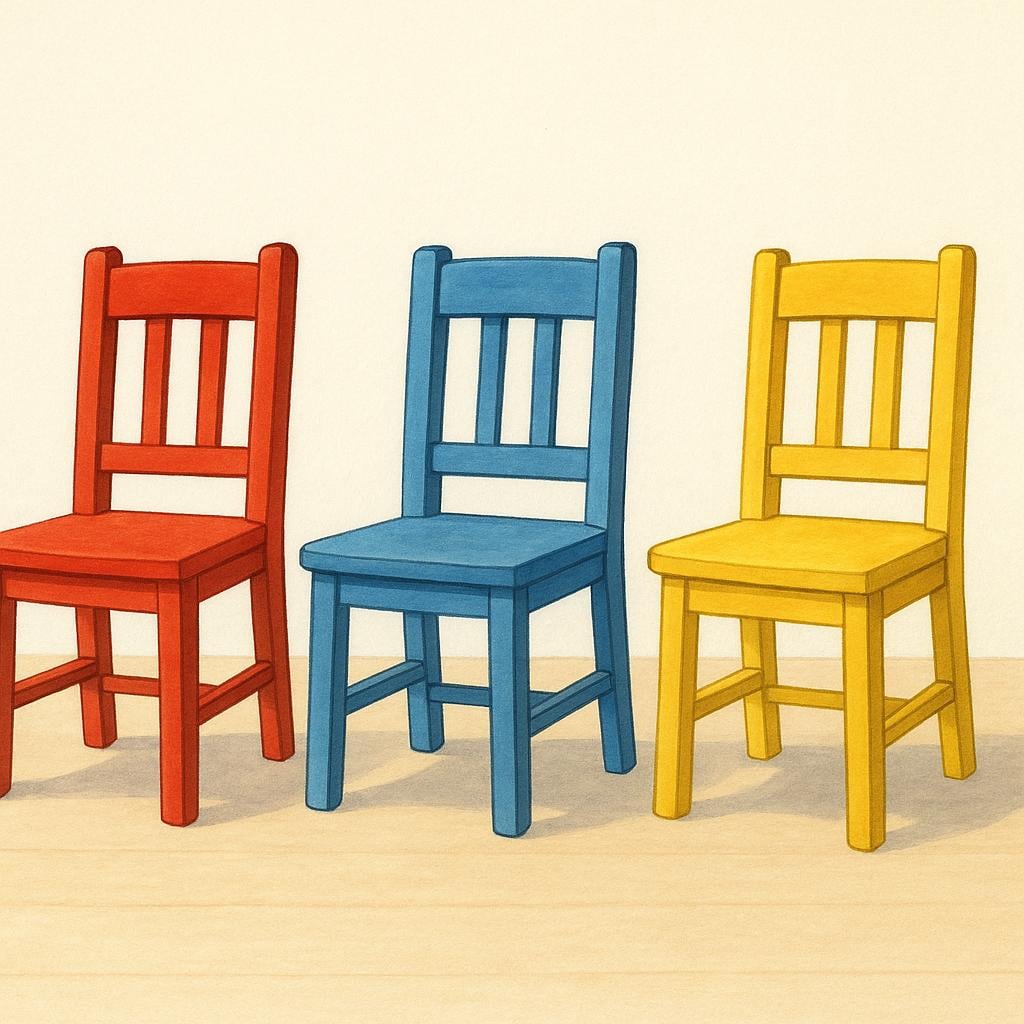 Three simple, brightly colored chairs (red, blue, and yellow) standing side-by-side on a light wooden floor.