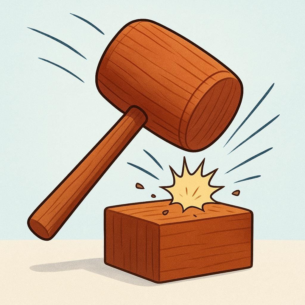 A large, wooden mallet is striking a sturdy wooden block, with visual action lines indicating the strong force of the impact.