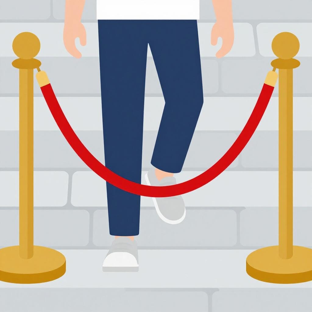 Una persona che scavalca una corda di barriera rossa brillante su un sentiero di pietra.