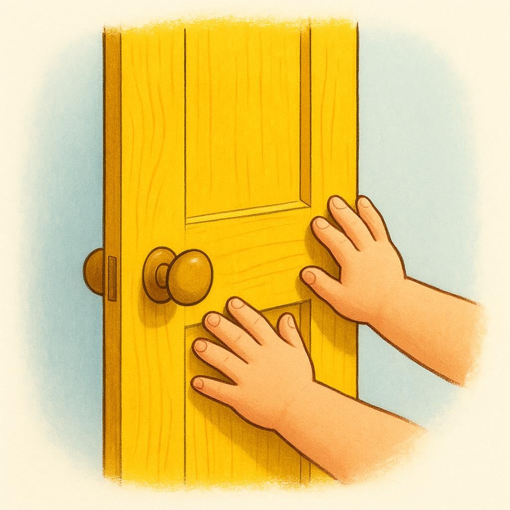A pair of small hands pushing open a bright yellow wooden door.