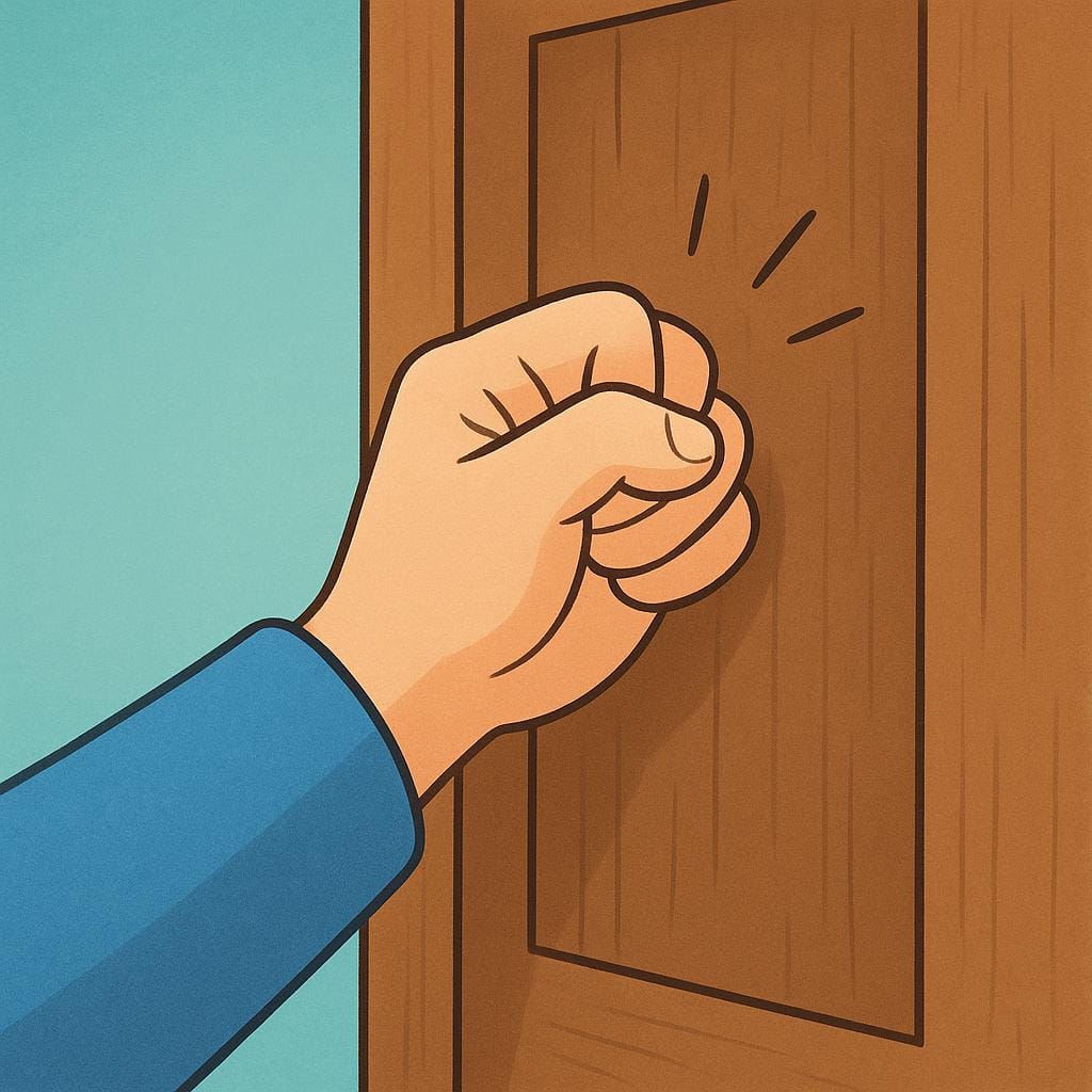 A close-up view of a hand with a slightly clenched fist knocking on a plain wooden door.