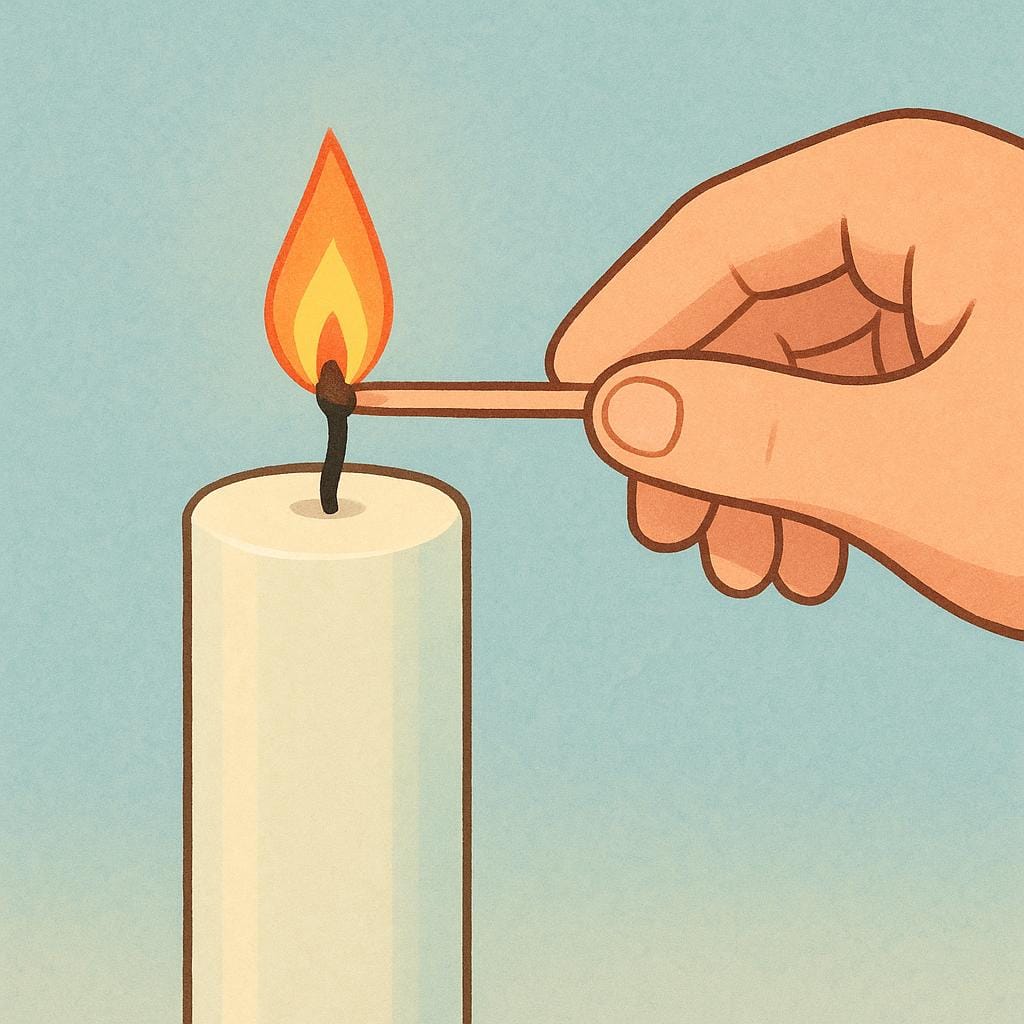 A person using a long match to light the wick of a thick, colorful candle, creating a soft flame.