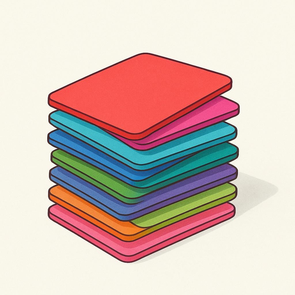 A small stack of colorful, generic rectangular cards, such as blank index cards or playing cards, sitting on a simple surface.