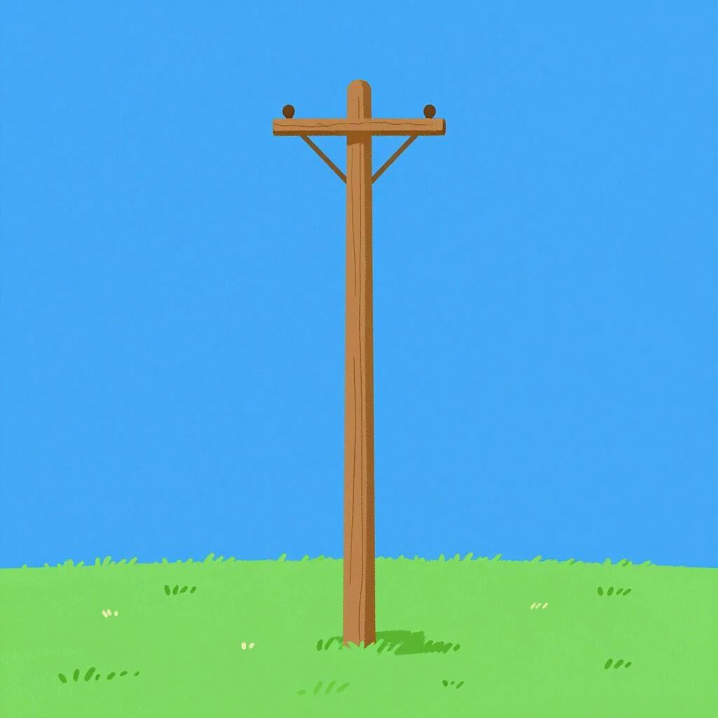 Un palo della luce in legno, alto e dritto contro un cielo azzurro limpido.