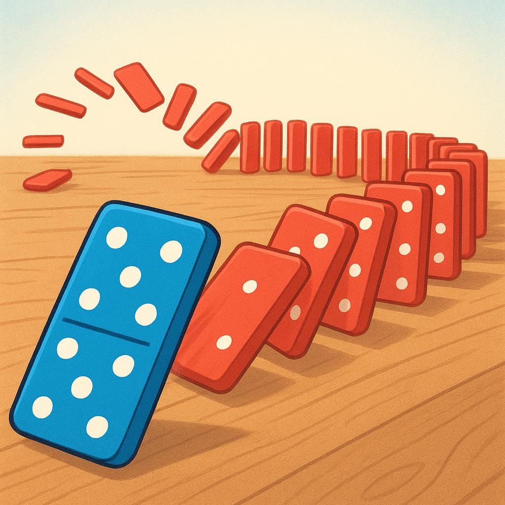 A single blue domino tile has just fallen over and is pushing the first tile of a long line of red dominoes, illustrating a chain reaction or causation.