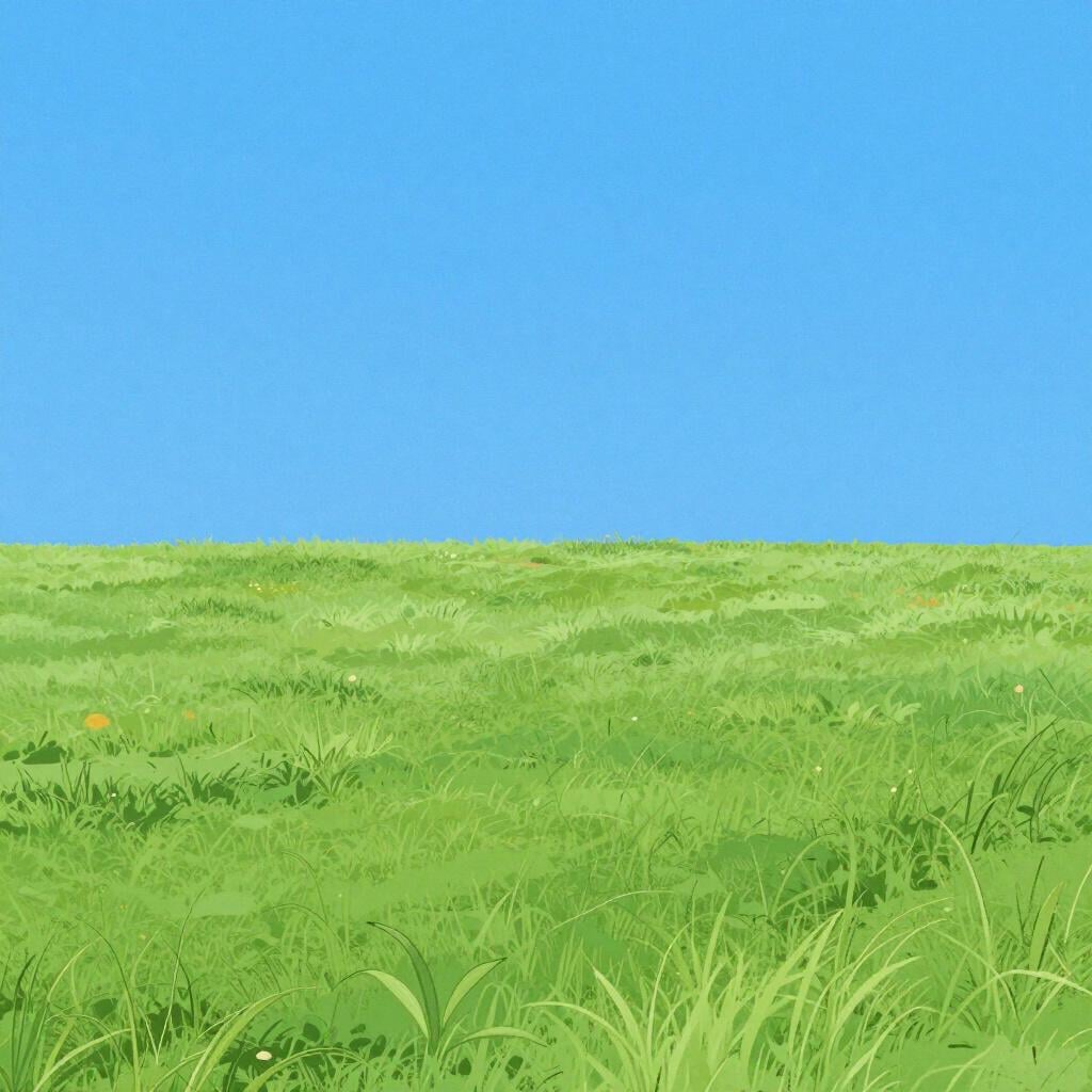 A wide landscape showing a clear line where the blue sky meets the green rolling hills.