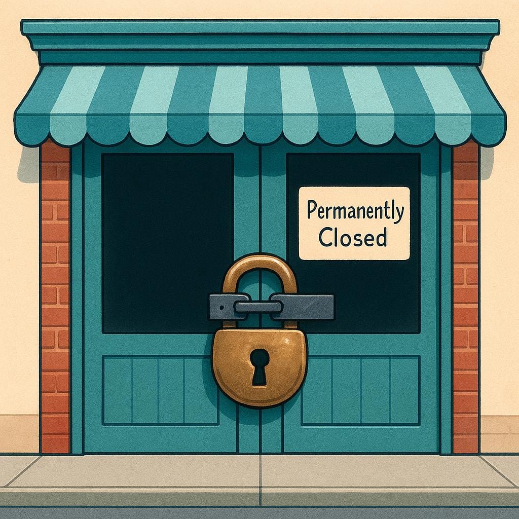 A closed, dark storefront secured with a large, heavy brass padlock on the front doors, symbolizing a business closing down.