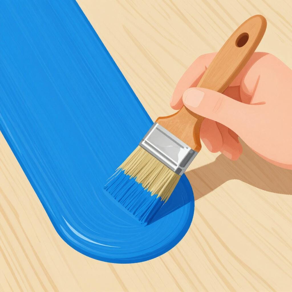 Ein Holztisch, der mit einer dicken Schicht blauer Farbe gestrichen wird.