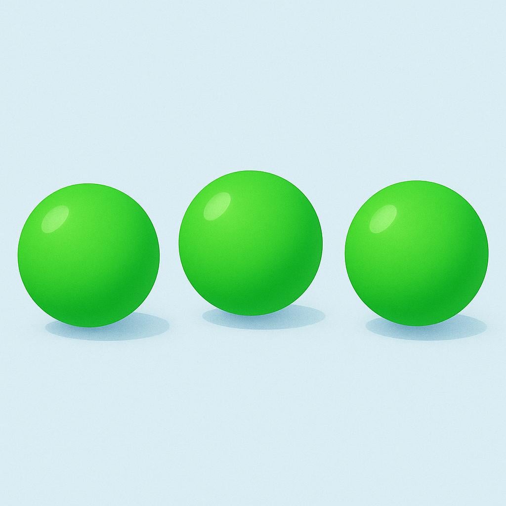 A collection of three brightly colored green spheres arranged together against a neutral background.