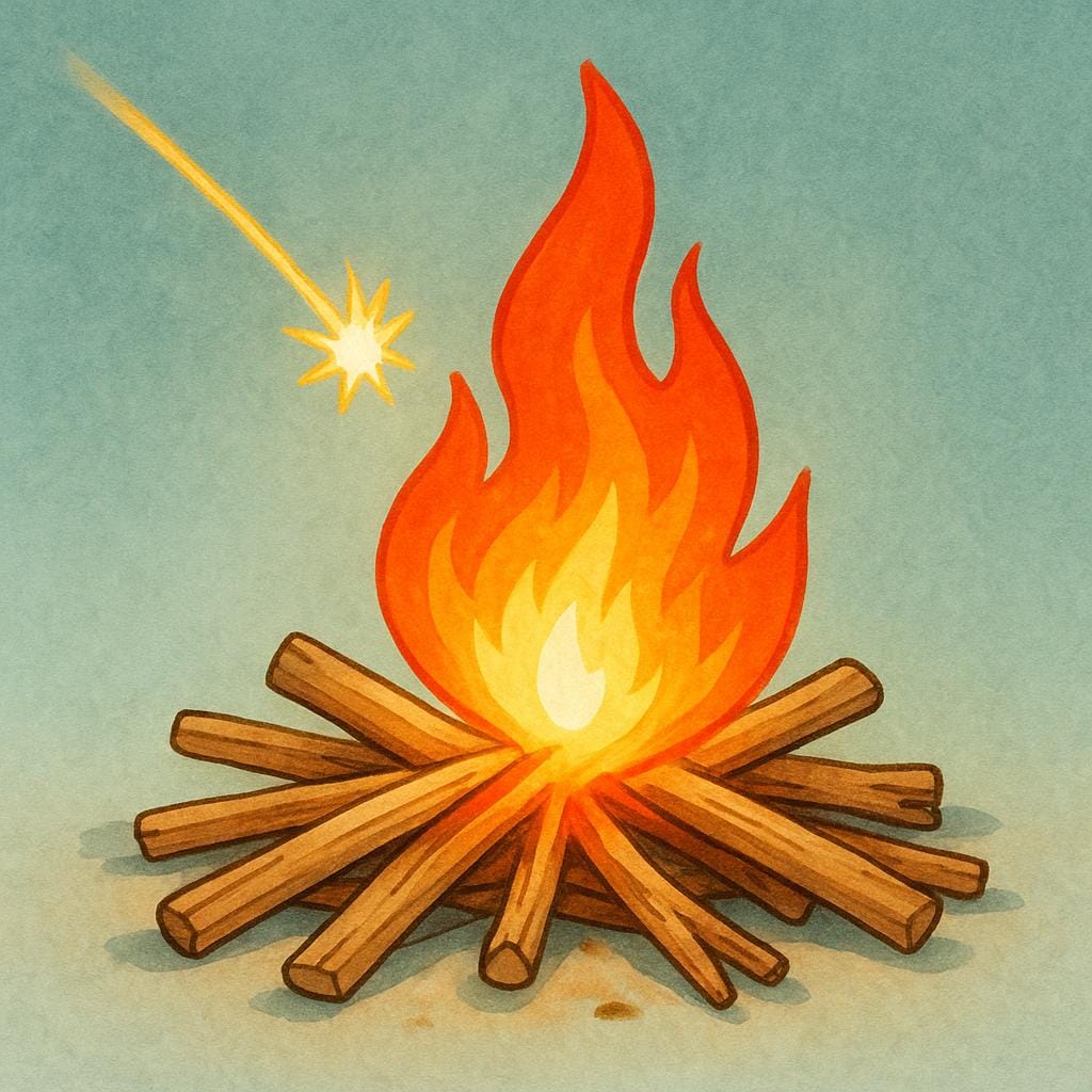 A single spark landing on a pile of dry kindling wood, causing a bright, initial burst of flames.