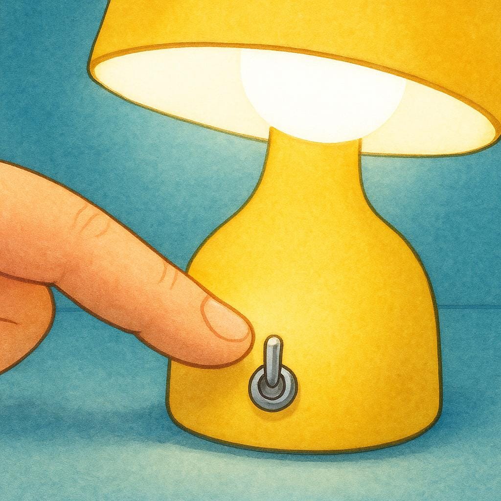 A finger pressing a switch to turn on a bright yellow table lamp, causing illumination.