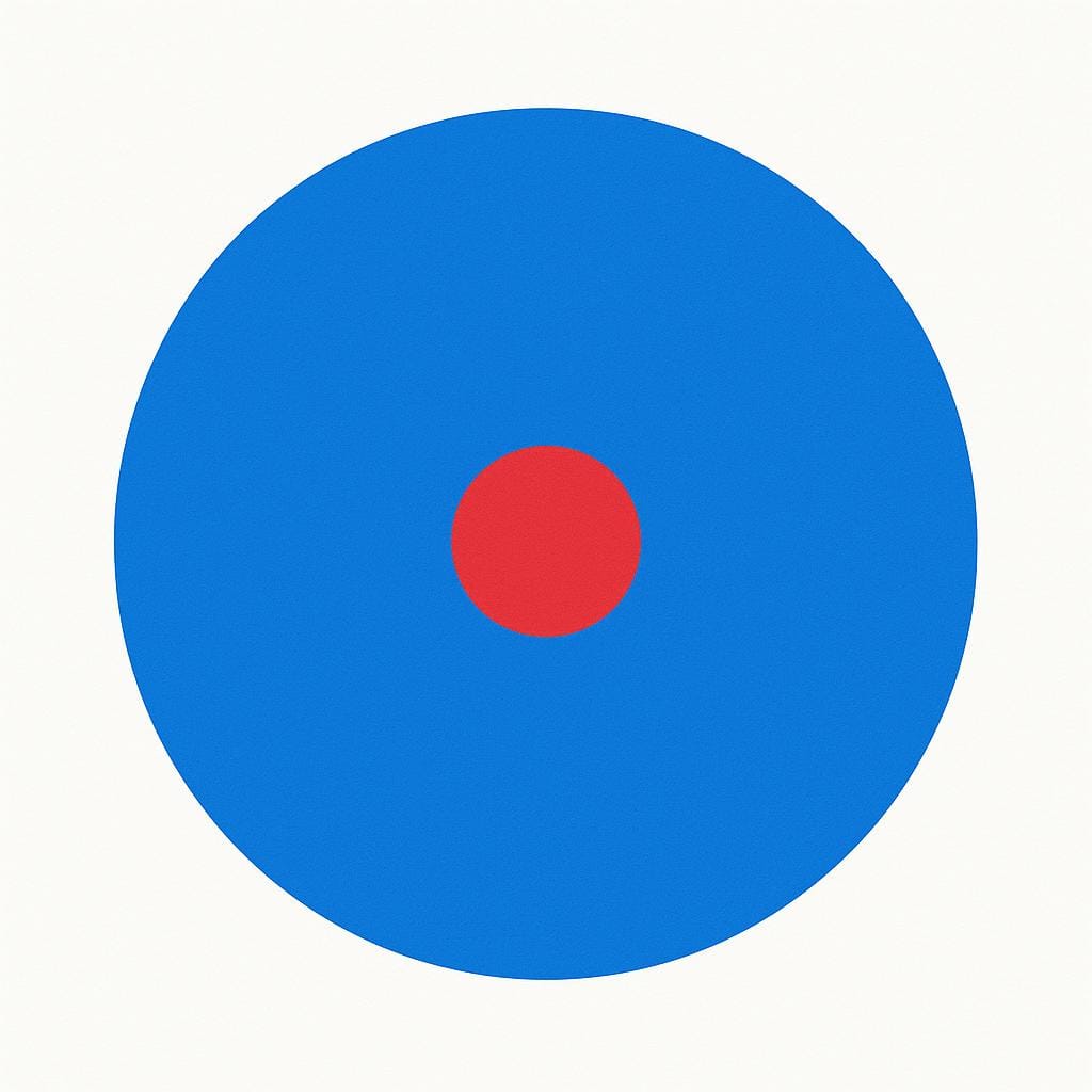 A perfectly centered red dot placed inside a large blue circle on a plain background.