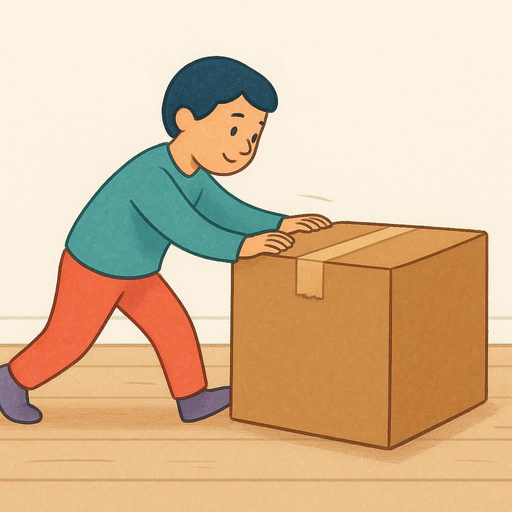 A person wearing a blue shirt is pushing a large brown wooden box across a smooth floor, demonstrating physical displacement.