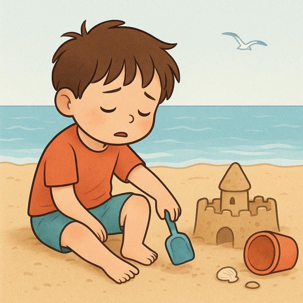A small child sits slumped on the sand next to a half-finished, crumbling sandcastle, dropping their red bucket and shovel in defeat.