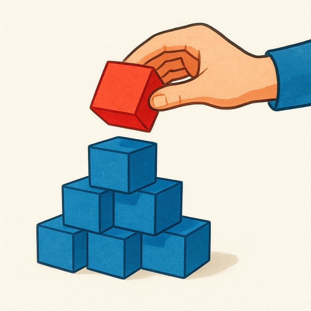 Een close-up illustratie van een hand die per ongeluk één felrode blok tussen een stapel identieke felblauwe blokken plaatst.