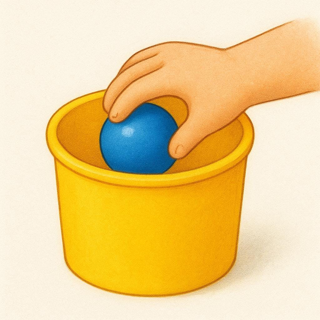 A hand reaching into a simple box and pulling a single object out.