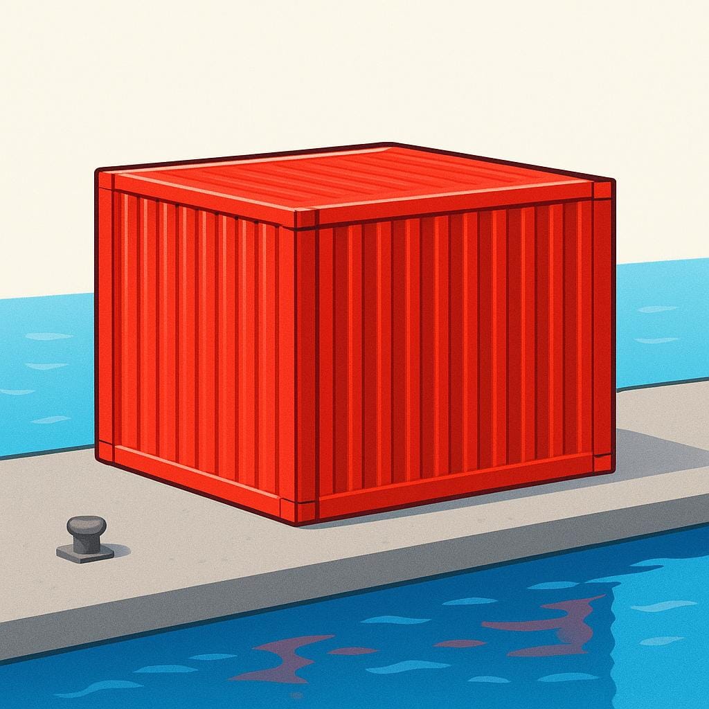 A massive, bright red corrugated metal shipping container resting on a concrete dock, ready for maritime transport.