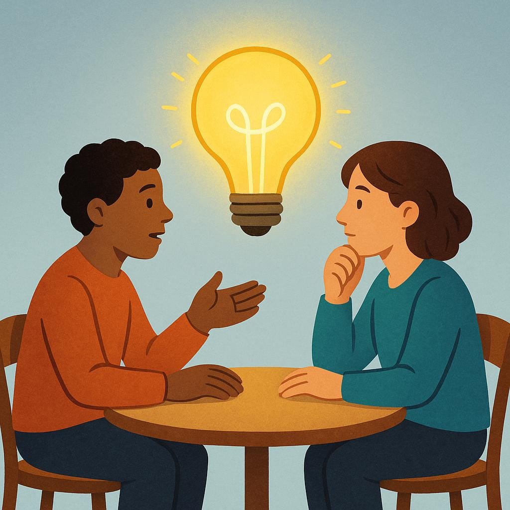 Two figures sitting at a table engaged in a conversation, focused on a centrally hovering, brightly glowing lightbulb, symbolizing a topic or idea.