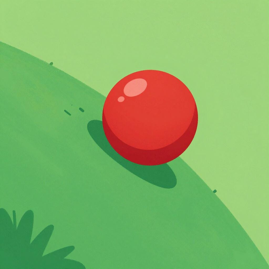 A bright red ball rolling down a gentle grassy slope.