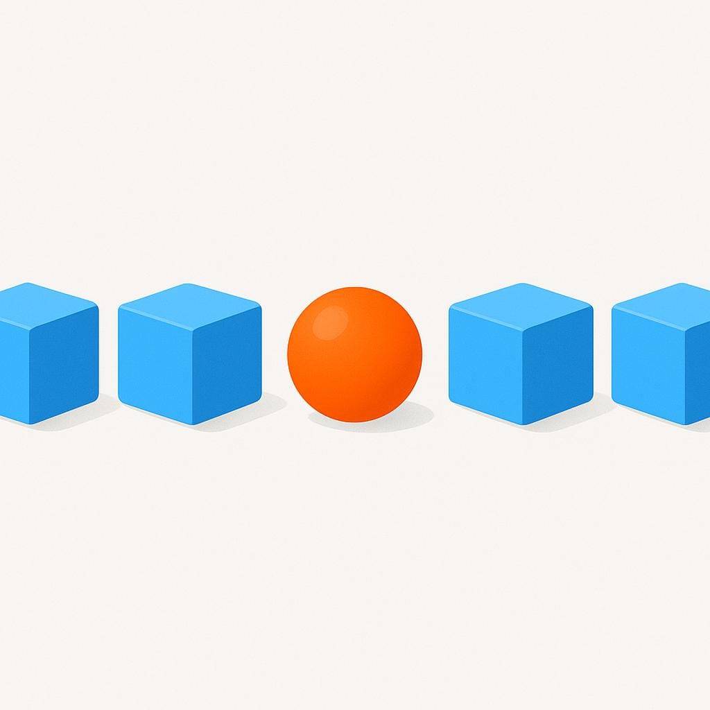A simple illustration showing a line of five identical blue cube blocks. One block is replaced by a bright orange sphere, clearly standing out from the others.