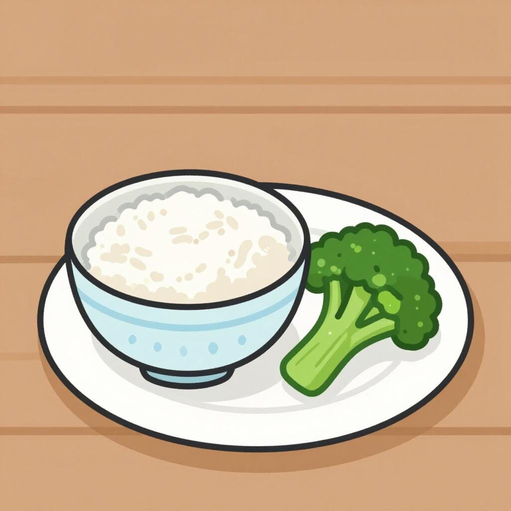 En liten skål med fluffigt vitt ris och en liten skål med ångad grön broccoli som sitter bredvid en huvudtallrik.