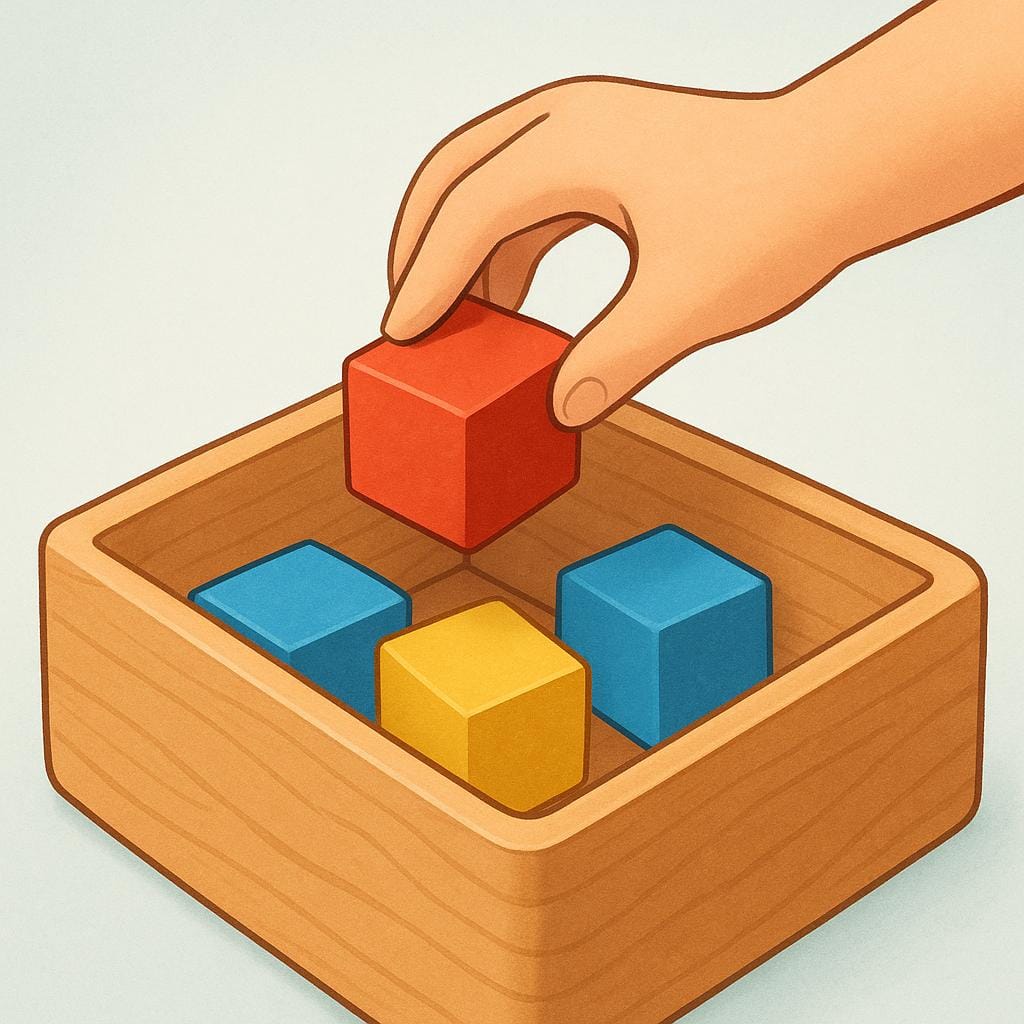 A child's hand placing a red block into a wooden toy box already full of other colored blocks, illustrating the action of inclusion.