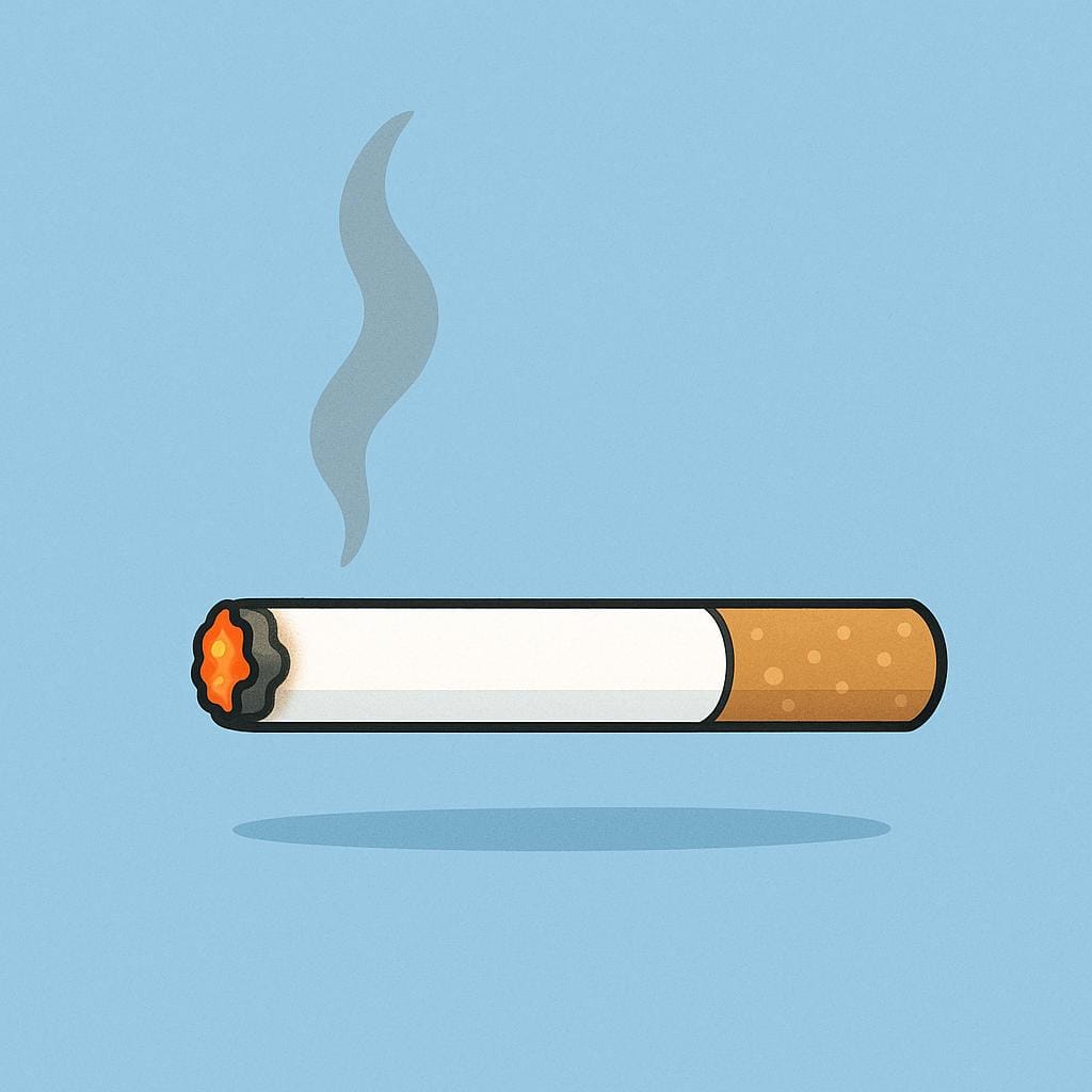 A single, lit white cigarette resting horizontally on a flat surface, emitting a thin wisp of smoke.