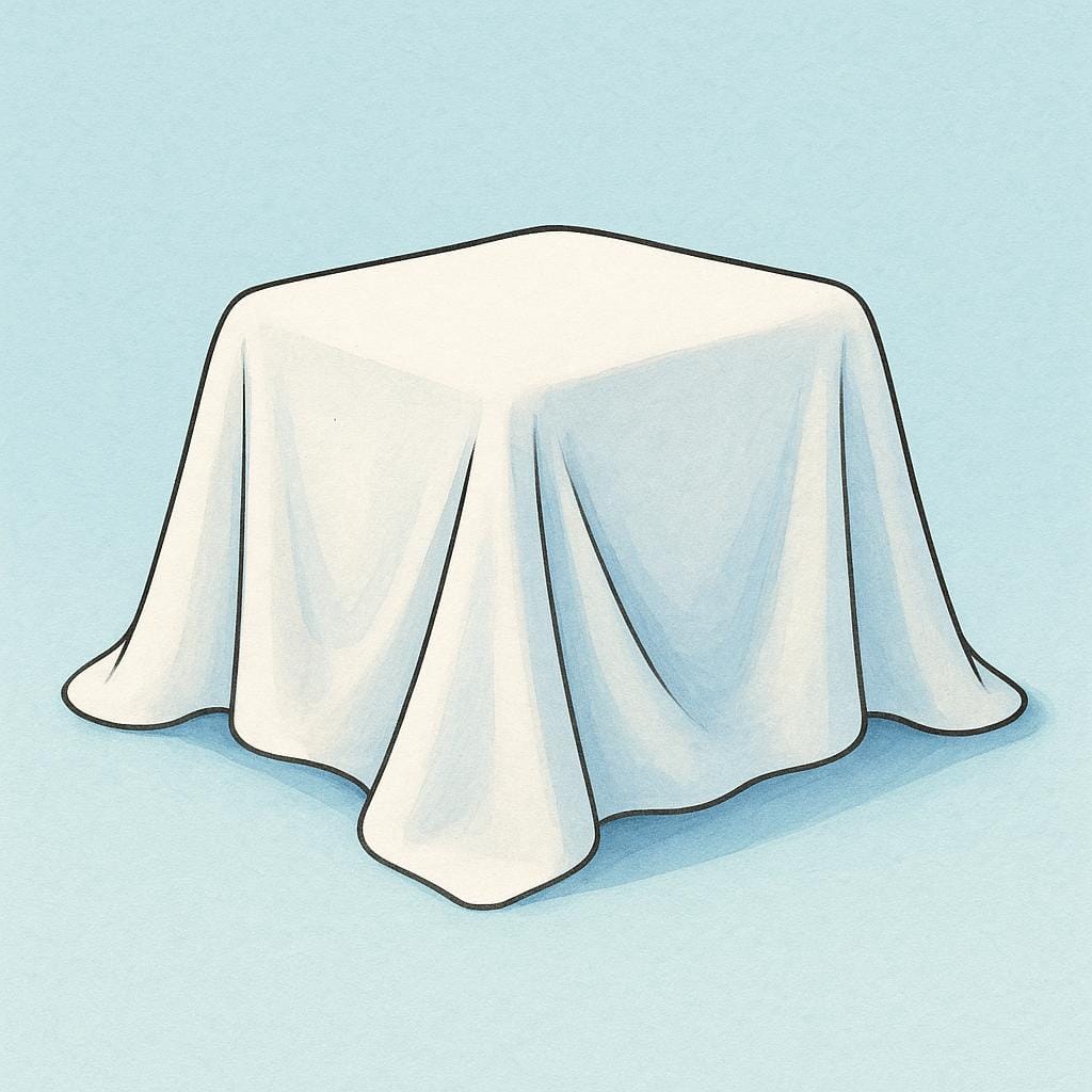 A simple red box completely concealed beneath a large, draped white cloth.