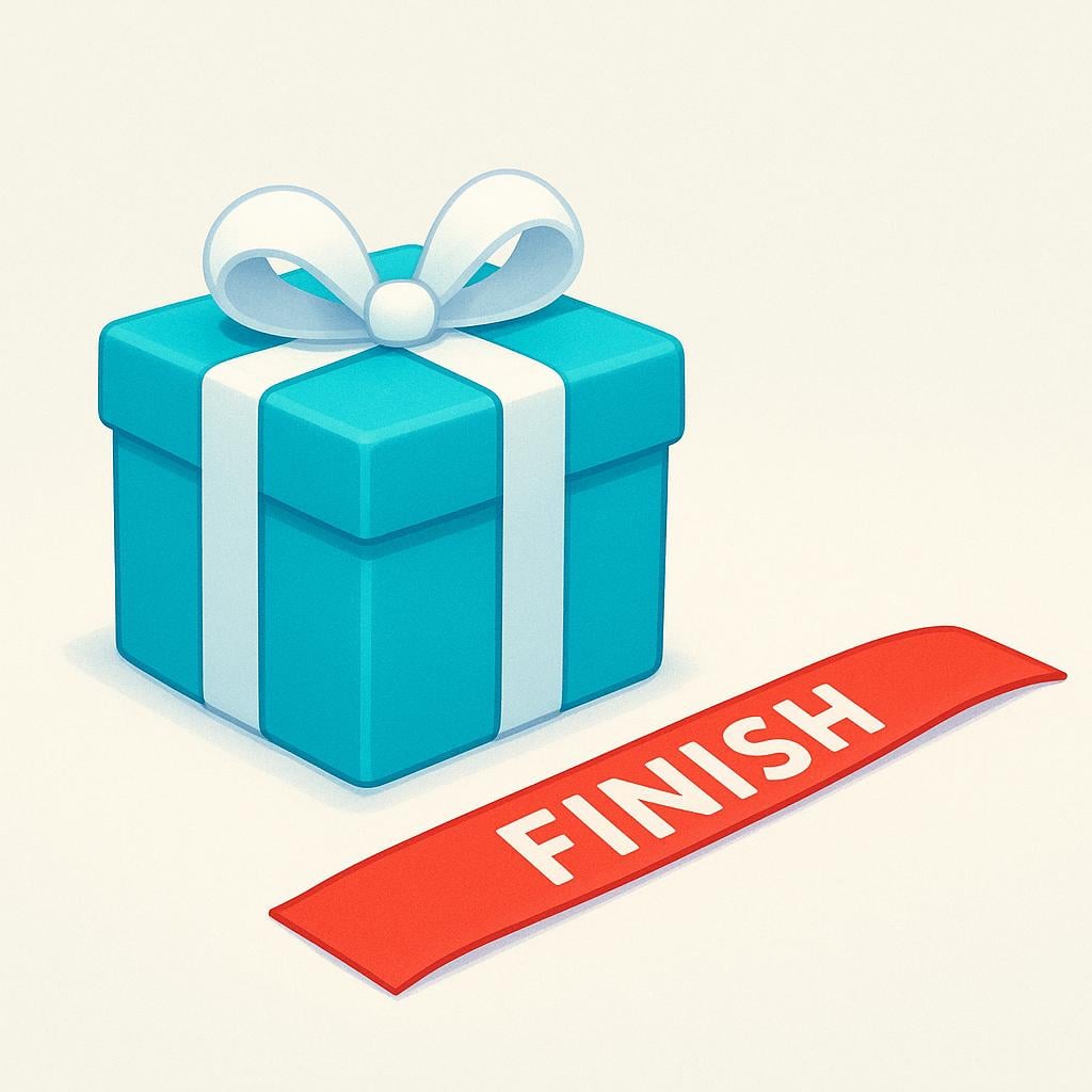A brightly colored, wrapped present sitting right up against a red ribbon finish line on a desk.