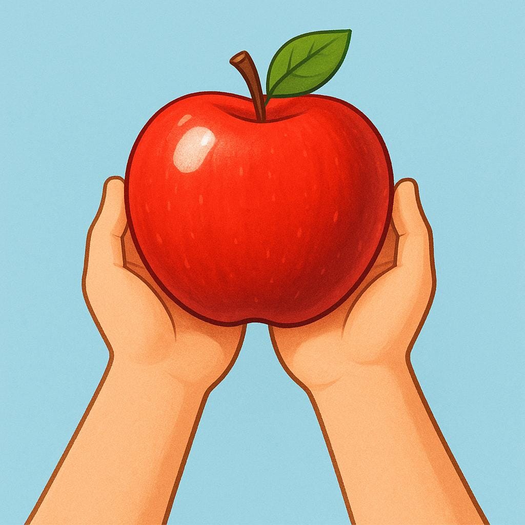 A person holding up a bright red apple to show it to someone else.