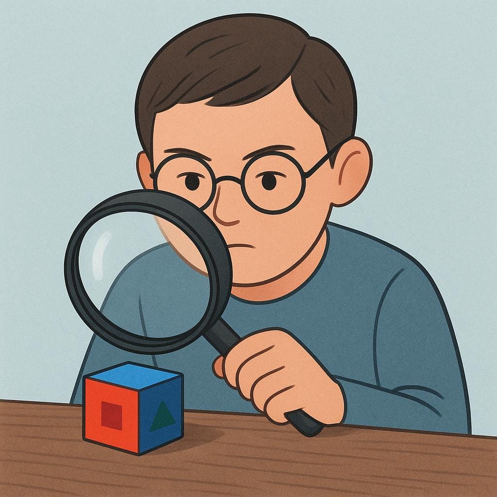 A thoughtful character wearing glasses, holding a large magnifying glass and closely examining a small, brightly colored object on a table.