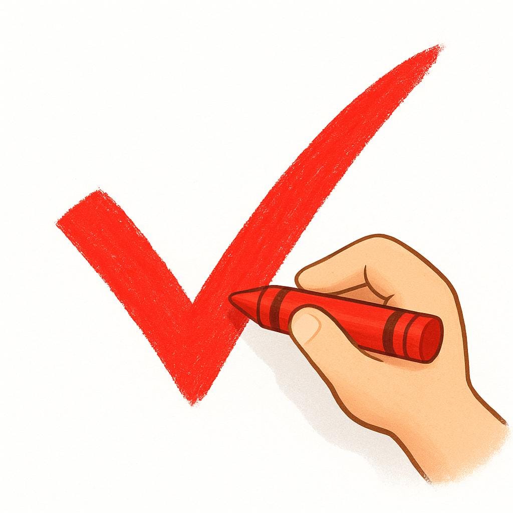 A child's hand holding a red crayon making a distinct checkmark on a blank white surface.
