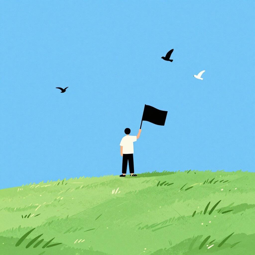 A person standing in an open field, holding a flag with a circle and an 'A' symbol, looking towards a horizon with no fences.