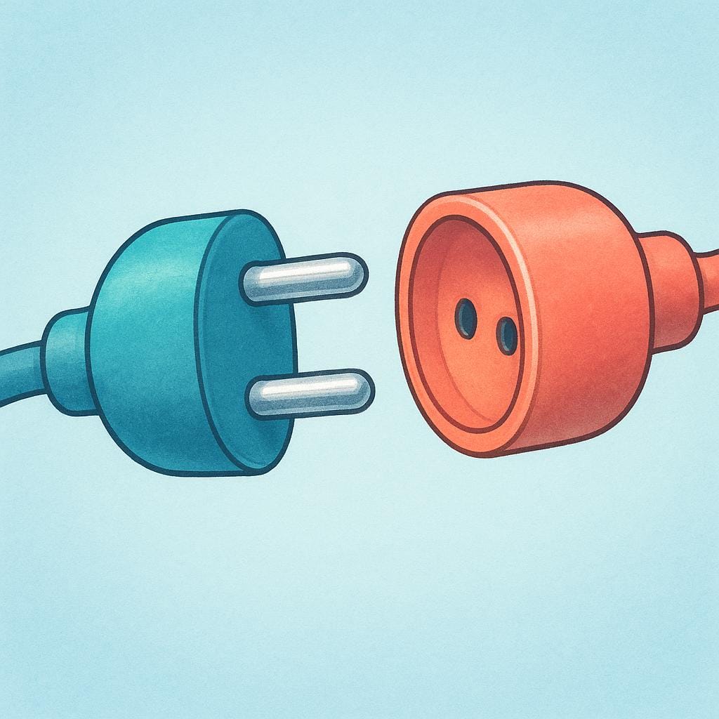 A close-up view of two distinct metal electrical connectors, a prong and a receptacle, poised to connect, illustrating a physical point of connection.